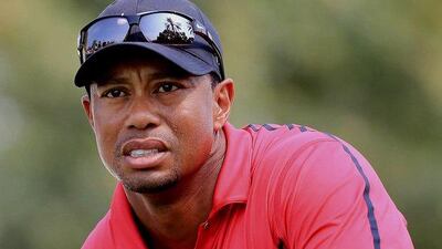 Tiger Woods follows his ball after he tees off at the 14th hole during the final round of the Dubai Desert Classic on Sunday. AP Photo
