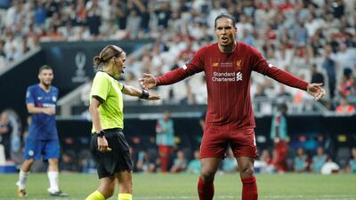 Referee Stephanie Frappart as Liverpool's Virgil van Dijk reacts after she awarded a penalty to Chelsea. Reuters