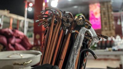 Camel sticks for sale at a makeshift market on Million Street at the Al Dhafra Festival, Abu Dhabi. Victor Besa / The National