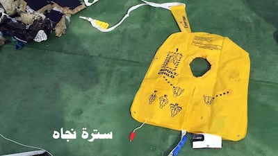 This picture, one of several posted to the official Facebook page of the Egyptian armed forces spokesman on Saturday, shows a life vest from EgyptAir flight 804. The Arabic reads: "Life vest". Egyptian Armed Forces via AP