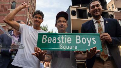 Adam “Adrock” Horowitz (C) and Michael “Mike D” Diamond (L) of the hip hop music band Beastie Boys, with New York City Council Member Christopher Marte unveil "Beastie Boys Square," in the Manhattan borough of New York City. The corner at the intersection of Ludlow and Rivington streets was the gatefold cover for the band's second album “Paul’s Boutique. ” AFP