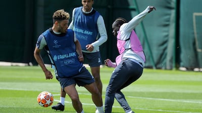 Liverpool's Alex Oxlade-Chamberlain, left, and Liverpool's Sadio Mane take part in training. AP Photo