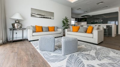 The 6-bedroom family home has porcelain tile flooring with a large open living area. Courtesy Luxhabitat