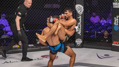 Hussein Salem attempts a choke on Nizar Ben Amara.