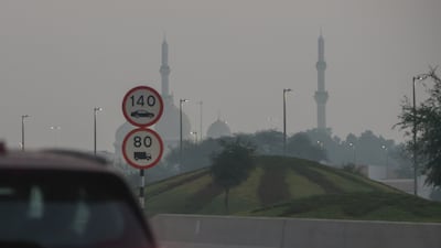 Speed limits were reduced to 80kph on Abu Dhabi roads due to dense fog. Victor Besa / The National