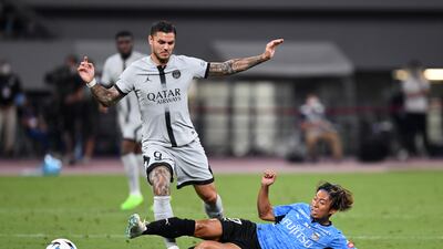 Mauro Icardi of PSG is tackled by Kawasaki Frontale's Kazuki Kozuka. Getty