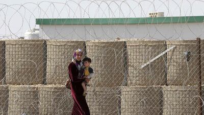 Fighting in Syria’s civil war has displaced millions of people, including this woman and child at the Zaatari refugee camp in the Jordanian city of Mafraq, near the border with Syria. Muhammad Hamed / Reuters / May 4, 2014
