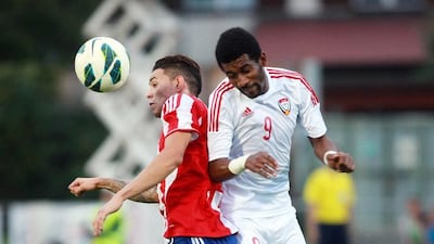 Paraguay's striker Tonny Sanabria, left, and the UAE's Abdulaziz Hussain both try for a header during their friendly at Villach, Austria, on September 7, 2014. DANIEL RAUNIG / AFP