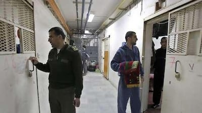 A Palestinian guard and Hamas prisoners at a prison in the West Bank city of Nablus.