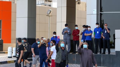 A surveillance drone hovers over residents in a neighbourhood of Kuwait City on May 12, 2020 as authorities try to ensure compliance with coronavirus regulations. AFP