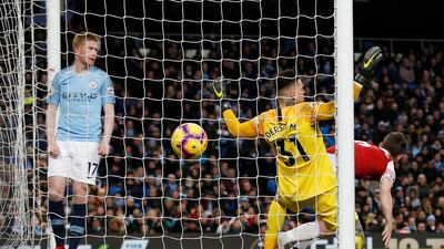 Arsenal's Laurent Koscielny scores their only goal. Reuters