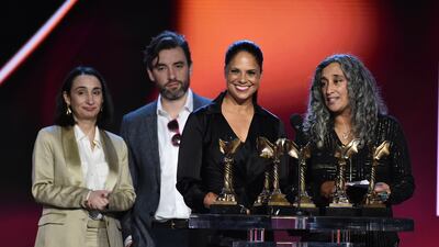 Soledad O'Brien, centre, accepts an award for documentary series 'Black and Missing' at the 37th Film Independent Spirit Awards. Invision / AP