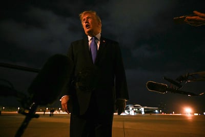 US President Donald Trump speaks to the media at Los Angeles International Airport on August 4. AFP