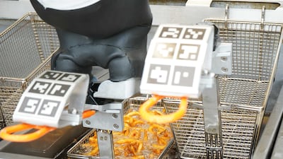 With a starting price of $3,000, the robot may appeal to fast-food outlets trying to cut costs. Here, Flippy deep fries onion rings.