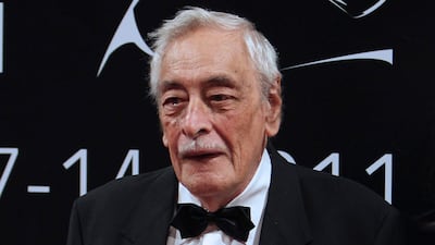 Egyptian actor Gamil Rateb poses for a photograph as he arrives on the red carpet during the 8th Dubai International Film Festival (DIFF) 2011. Photo / Getty