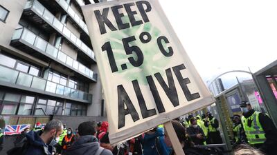 Activists demonstrate outside the Cop26 summit in Glasgow last year where global leaders met to discuss steps to cutting greenhouse emissions. AP Photo