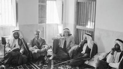 Roderic Owen, centre, in the upstairs majlis at Qasr al Hosn with Sheikh Zayed Al Nahyan, far left, and Sheikh Shakhbut al Nahyan, second right. The other men are unidentified. Literary Estate of Roderic Owen