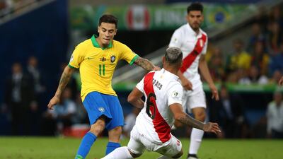 Philippe Coutinho is challenged by Peru's Miguel Trauco. Getty