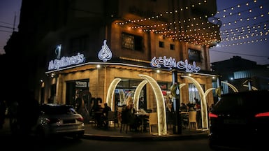 A cafe in Gaza city, where new storefronts indicate a shift toward a retail economy after farming and manufacturing were devastated by Israel's war. Bloomberg