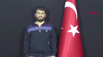 A grab taken from a video released by Demiroren News Agency shows Turkish citizen Yusuf Nazik, the alleged chief suspect in a 2013 bombing, delivering a speech after he was captured by the Turkish secret service. AFP/Demiroren News Agency
