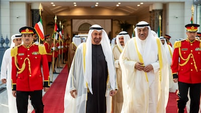 Sheikh Mohamed bids farewell to Sheikh Sabah Khaled Al Hamad Al Sabah, Crown Prince of Kuwait, before departing from Kuwait International Airport