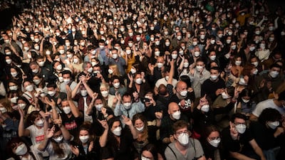 The crowd wearing face masks at a rock concert in Barcelona, Spain, on March 27. AP Photo