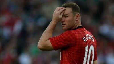 Wayne Rooney will be out for another two months out with a bad cut to his leg. Patrik Stollarz / AFP