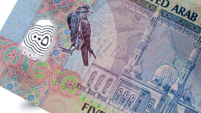 Keren Bobker advises a worker on gratuity payments. Photo by The National Staff