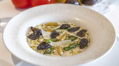 Asparagus and morels risotto at La Petite Maison: made with non-alcoholic white wine, mascarpone, garlic, shallots and garnished with green and white asparagus, morel mushrooms, and shaved Parmesan 