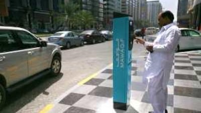 Chaudry Khan at one of the parking meters on Hamdan Street in Abu Dhabi yesterday.