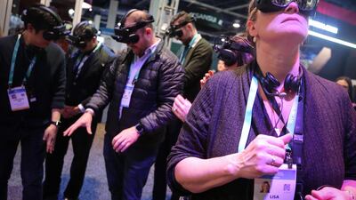Visitors try out AR glasses at the CES 2020, in Las Vegas, last week. AFP