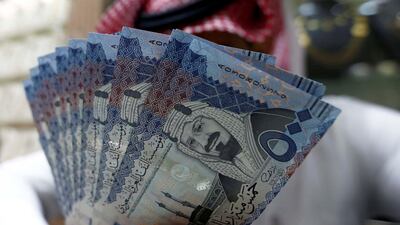 Saudi riyal banknotes at a currency exchange shop in Riyadh. The country's stock market may get a boost from the decision to allow women to drive. Faisal Al Nasser/Reuters