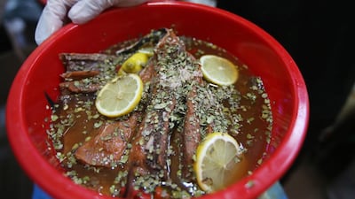 Maleh, a traditional Emirati dish, is made by leaving the fish in a box to absorb the spices, salt and oil. Ravindranath K / The National