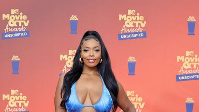 Chasity Saunders wearing a blue string ensemble. AFP