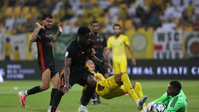 Al Wasl's Renato Junior battles with United's Kouame Autonne.