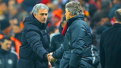 Jose Mourinho, left, and Roberto Mancini have both managed Inter Milan in the past. Michael Regan / Getty Images