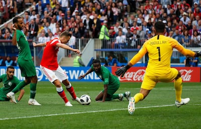 Denis Cheryshev, in red, gives Russia a 2-0 lead in their Group A opener against Saudi Arabia. EPA