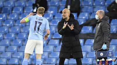 Manchester City manager Pep Guardiola talks to Kevin De Bruyne during the Champions League quarter-final first leg against Borussia Dortmund. EPA