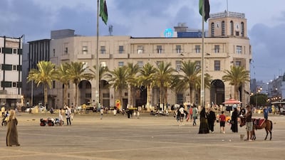 Libyan families gather in Martyrs' Square in Tripoli. AFP