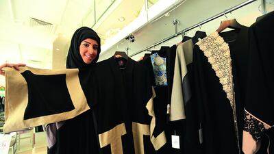 Fatma Al Mosa, Folak’s owner/designer, shows off her abayas at her shop in Abu Dhabi. Ravindranath K / The National