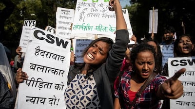 People hold placards and shout slogans as they take part in a protest against the alleged rape and murder of a 27-year-old woman on the outskirts of Hyderabad. Reuters