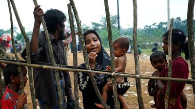 A Rohingya refugee cries as she arrives with a group near the makeshift Kutupalang refugee camp in Cox’s Bazar, Bangladesh, on August 30, 2017. Mohammad Ponir Hossain / Reuters