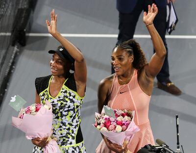 Venus Williams, left, and sister Serena, during the Mubadala World Tennis Championship in Abu Dhabi in 2018. AP