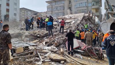 Rescuers search the rubble of collapsed buildings in Yesilyurt after a 5,6 magnitude earthquake hit the Turkish province of Malatya on February 27. AFP
