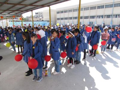 Schoolchildren line up for roll call at the start of the school year at the UNRWA-run Al Nuzha School for Girls in Amman, Jordan. Taylor Luck for The National
