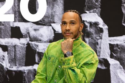 Lewis Hamilton poses during the Signature talk “Being a Pilot” with Valentino Rossi in Geneva, Switzerland. Getty