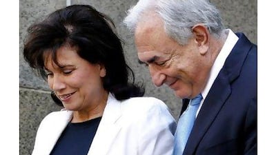 Former International Monetary Fund leader Dominique Strauss-Kahn leaves New York State Supreme court with his wife Anne Sinclair on Friday.