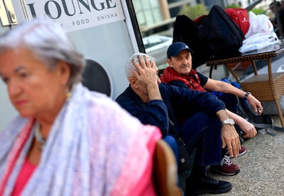 Passengers stranded in front of a hotel in Doha. EPA / HANNIBAL HANSCHKE