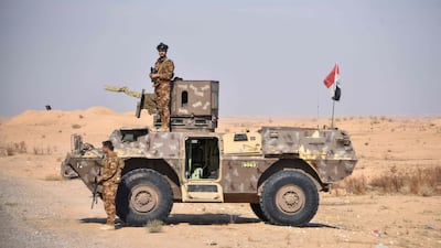 Members of a joint force standing guard at the Iraqi-Syrian border on December 5. AFP