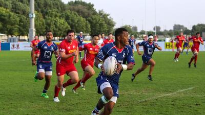 The Jebel Ali Dragons, pictured in blue playing Bahrain in January, moved into fourth in the West Asia Premiership standings with victory over Dubai Exiles on Friday. Victor Besa for The National